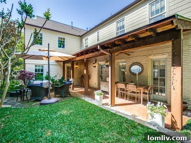 Expansive green lawn in the backyard of the Dallas farmhouse