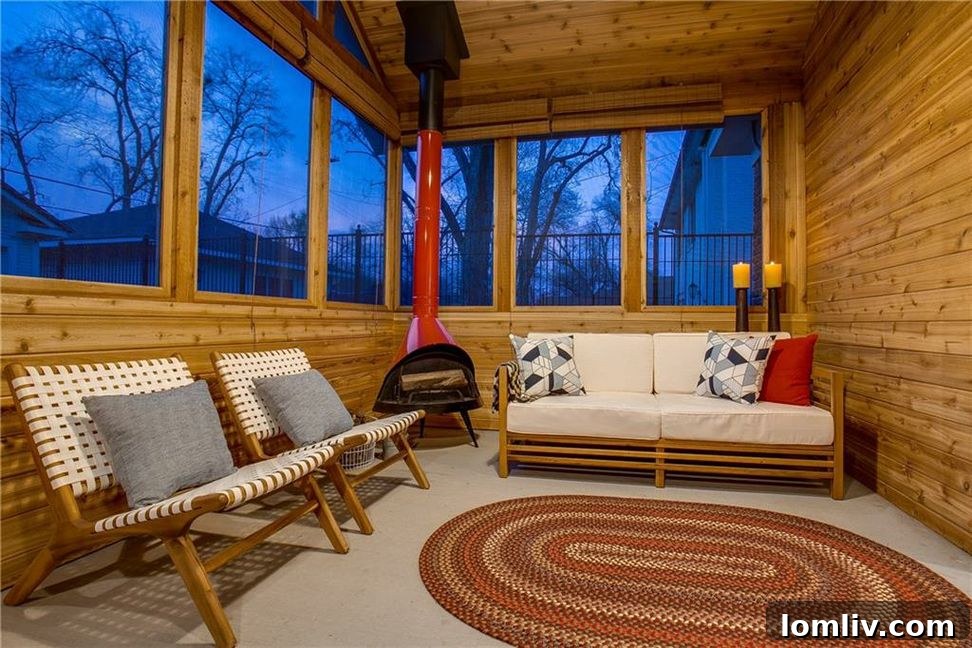 Unveiling North Oak Cliff's Singular Masterpiece 15 Cathedral ceiling and fireplace in the screened porch