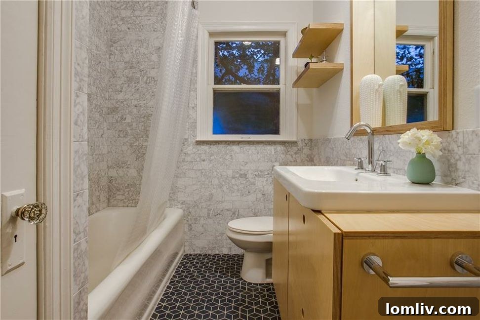 Unveiling North Oak Cliff's Singular Masterpiece 20 Hallway leading to bedrooms, emphasizing natural light
