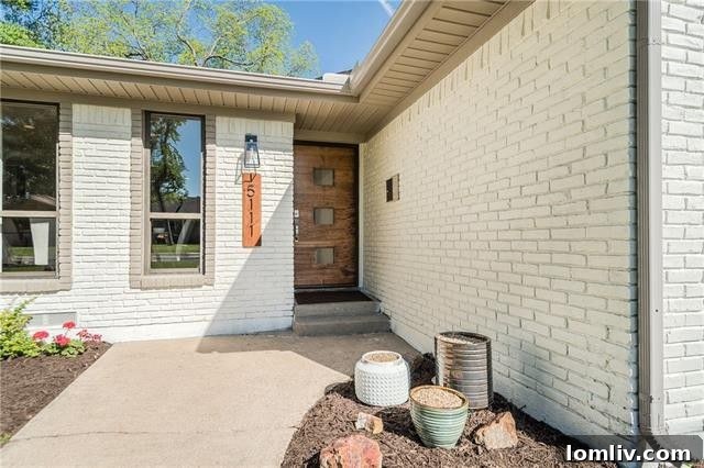 Big Buckner Terrace Renovation Transformed and Triumphant 4 Front entrance and custom contemporary door of Buckner Terrace home