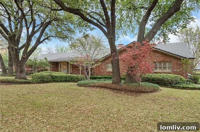 Stunning mid-century modern home exterior with mature oak trees and classic ranch facade