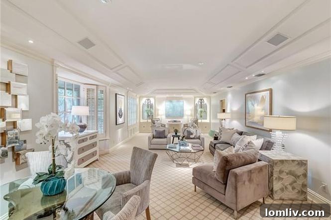 Spacious living area with tray ceiling, cool gray walls, and custom wool carpet