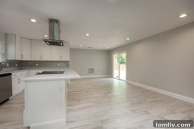 Detailed shot of pearlescent tile backsplash and quartz countertops