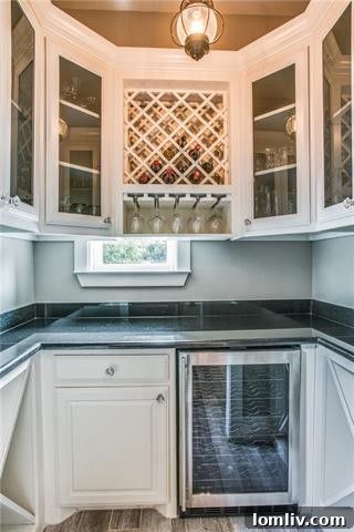 Walk-in pantry with built-in storage and wine fridge