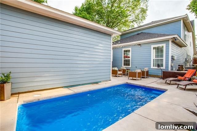 View of the home's rear exterior and charming backyard