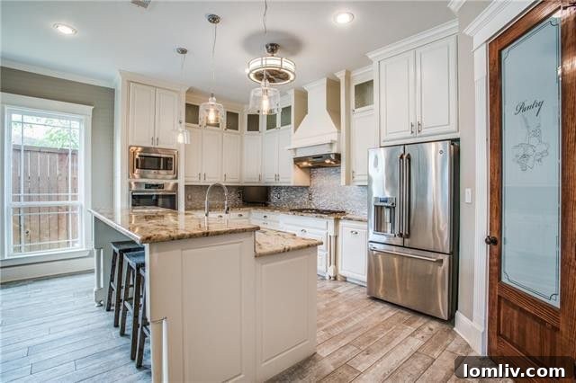Gourmet kitchen with granite island and stainless steel appliances