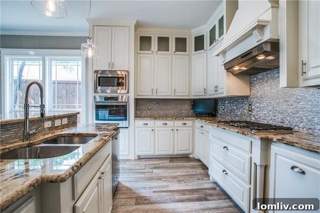 Modern kitchen with custom cabinetry and stylish backsplash