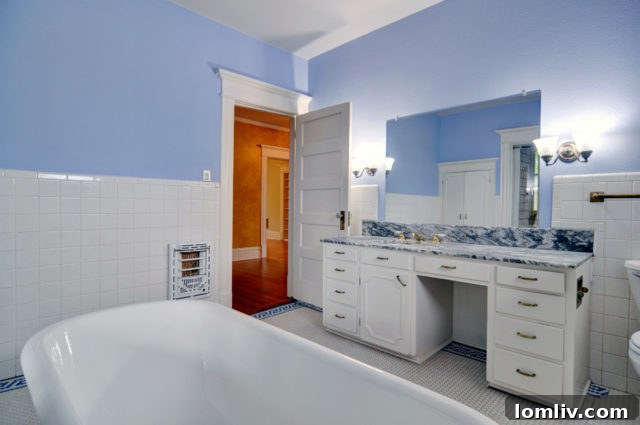 Bathroom with preserved original tile and fixtures in 1112 Elizabeth Blvd