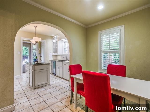 Modern Kitchen with Dual Sinks, Seeded Glass Cabinets, and Granite Counters