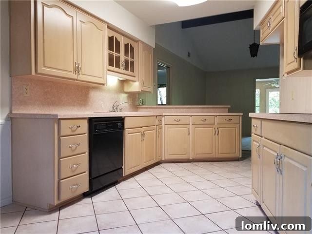 Elegant dining space with natural light, seamlessly connected to the kitchen and living areas, ideal for entertaining in Farmers Branch.