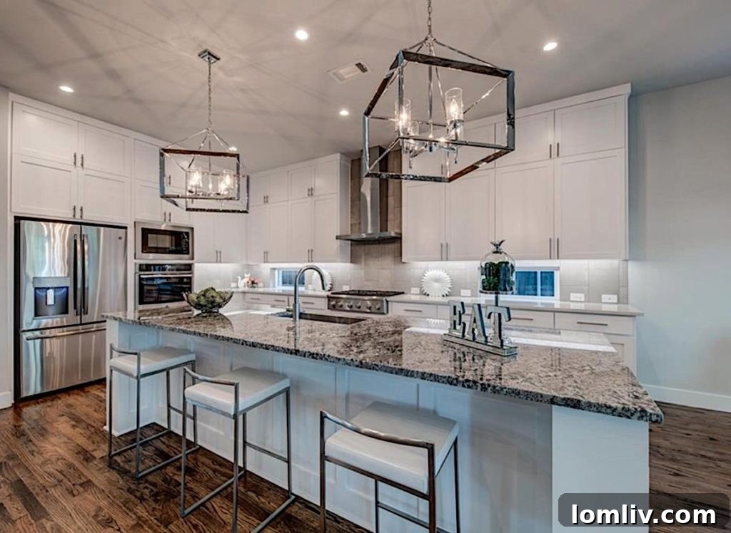 Luxurious Open-Plan Kitchen with High-End Appliances and Chandeliers