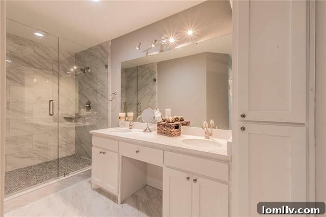 Second bathroom with clawfoot soaking tub and modern finishes