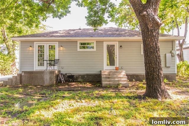 Expansive backyard with mature trees, offering privacy and potential