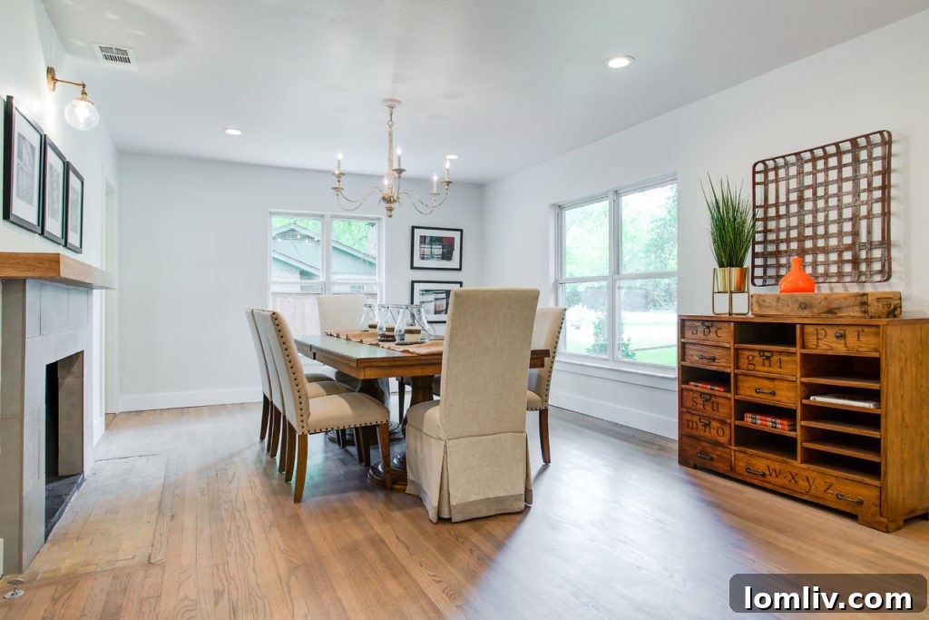 Spacious Dining Area with Designer Lighting and Large Windows in Casa Linda Home