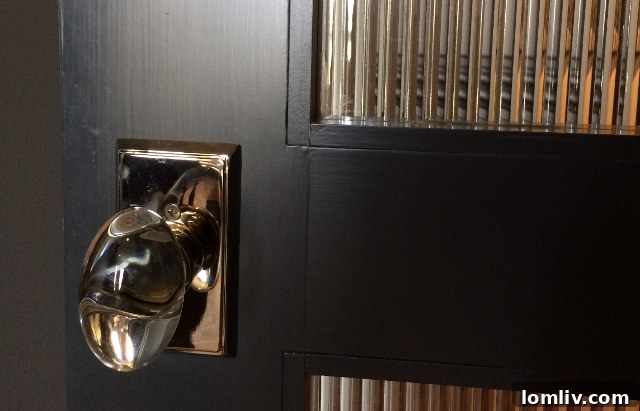 Details: Crystal doorknob and reeded glass bedroom door.