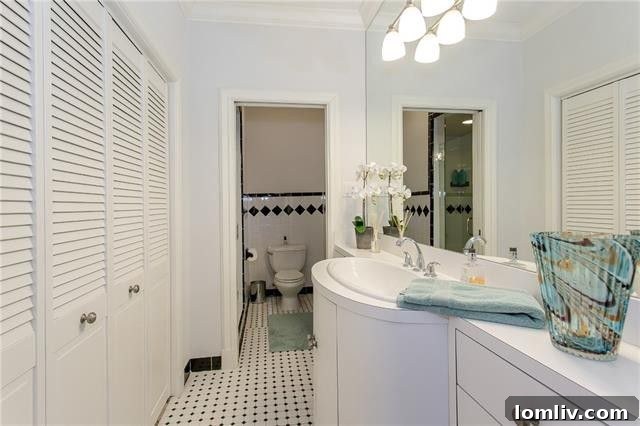 Elegant guest bathroom upstairs with ceramic tile