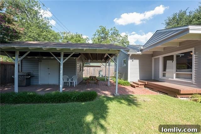Prestonwood Creek Contemporary Gem Tops Dallas Open House List 17 Private backyard with a new wooden deck, cedar privacy fence, and attractive landscaping