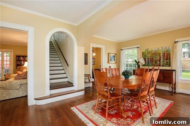 Cozy living space featuring a classic brick fireplace and elegant period details