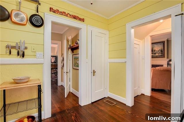 Dining area with vintage charm leading into the kitchen