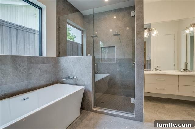 Luxurious master bathroom with modern fixtures and a spacious shower