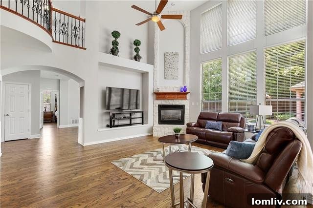 Living Area with Vaulted Ceilings and Walls of Windows in Allen Home