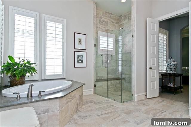 Luxurious Master Bathroom with Quartz Countertops and Extensive Storage