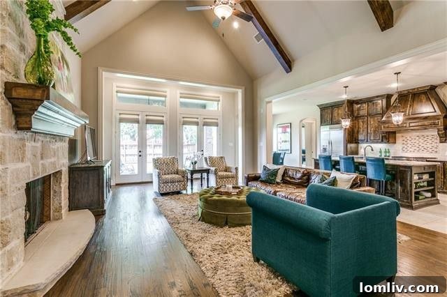Vaulted Beamed Ceilings and Stone Fireplace in Family Room