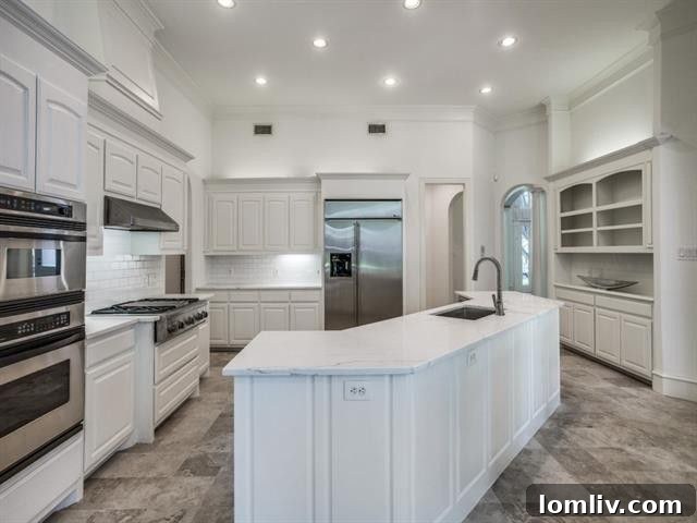 Bright and airy kitchen space with white cabinetry and ample natural light