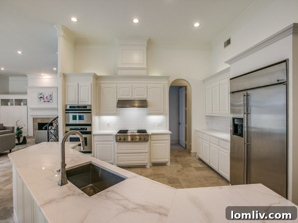 View from the kitchen into an adjoining living area, emphasizing open concept
