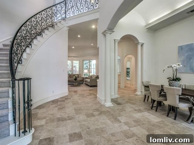 Skilled workers preparing walls for painting inside a luxurious home