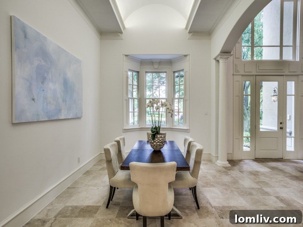 Brightly lit entrance hall of the luxury home, with scaffolding removed and fresh white paint