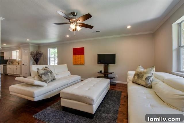 Spacious Living Room Flowing into Dining and Kitchen Areas at 9659 Leaside Dr.