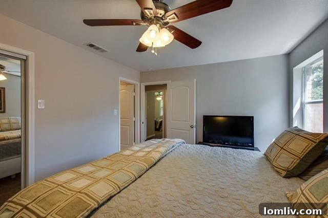 Spacious Dining Area with Modern Lighting and Hardwood Floors at 9659 Leaside Dr.