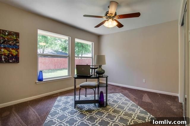Renovated Secondary Bedroom with New Flooring and Paint at 9659 Leaside Dr.