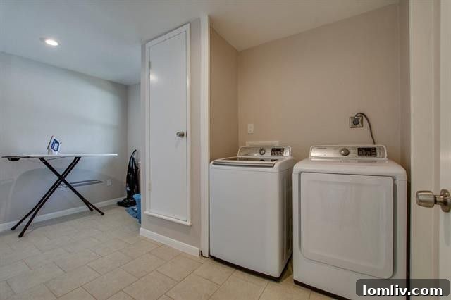 Spacious Living Area Leading to the Dining Room and Kitchen at 9659 Leaside Dr.