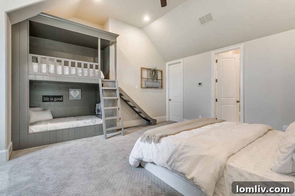 The second-floor bedroom with charming custom built-in bunk beds for younger guests
