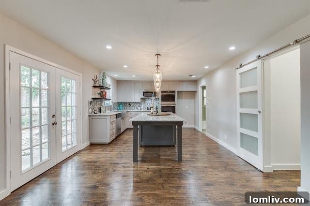 Rear View of Home with French Doors and Privacy Fence