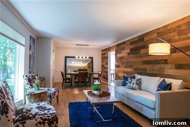 Spacious and Open Den and Dining Area with Elegant Wood Accent Walls