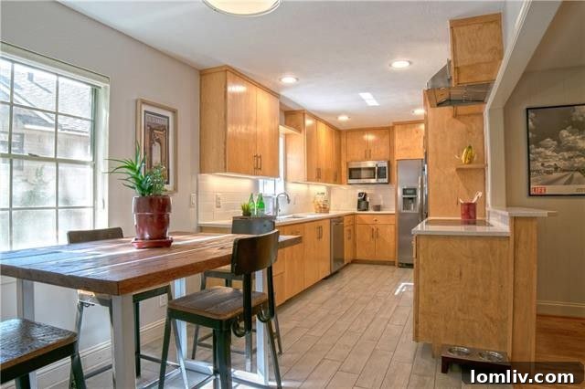 Modern Galley Kitchen with Subway Tile, Quartz Countertops, and Stainless Steel Appliances