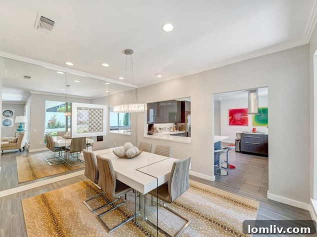 Elegant dining room connecting to the living room and kitchen with garden views