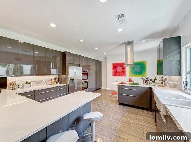Close-up of the pristine white quartz countertops and modern fixtures in the kitchen