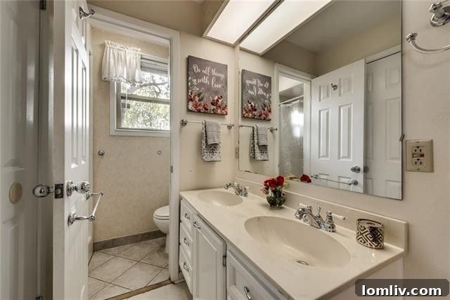Stylish guest bathroom with contemporary vanity, sleek fixtures, and a spacious shower, reflecting modern design