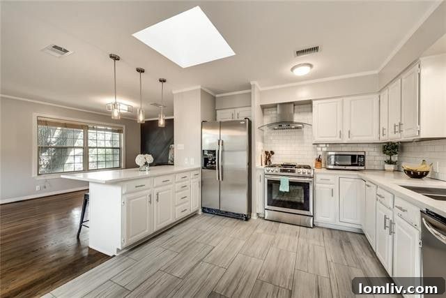 Spacious second bedroom, ideal for guests or a dedicated home office, featuring beautiful hardwood floors and ample room