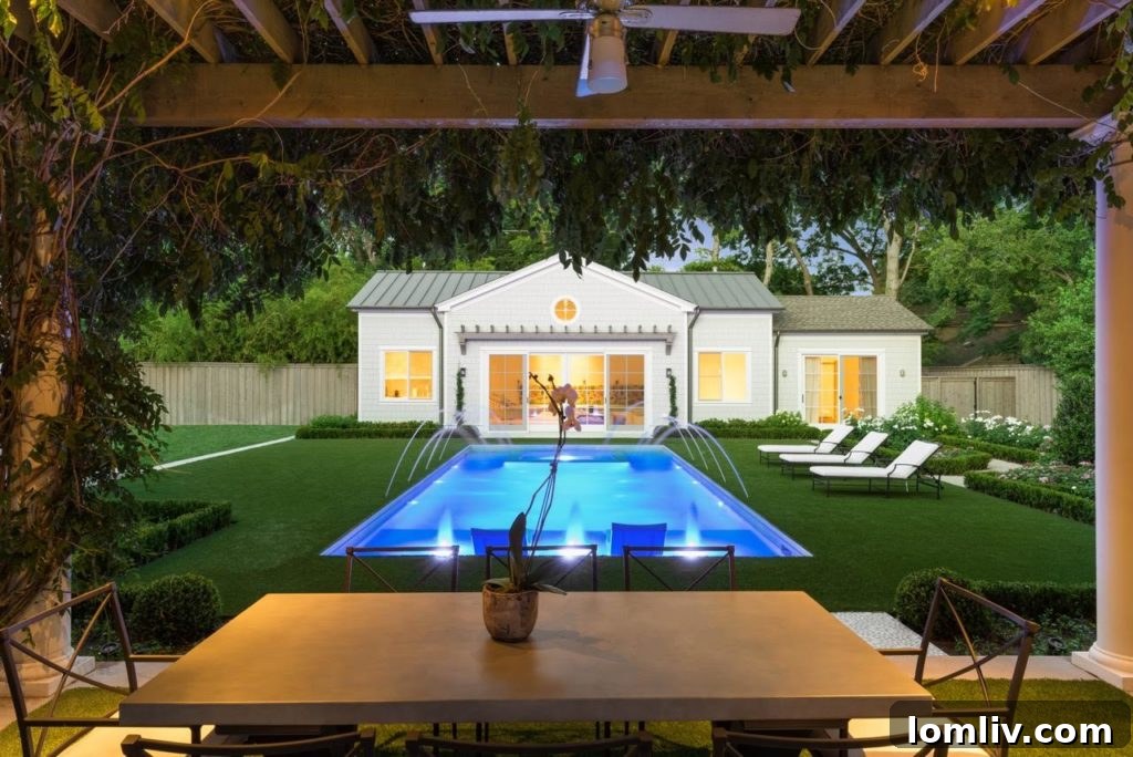 Innovative grass-edge pool design by Harold Leidner Landscape Architects, showcasing a unique blend of nature and modern luxury in a North Texas backyard.
