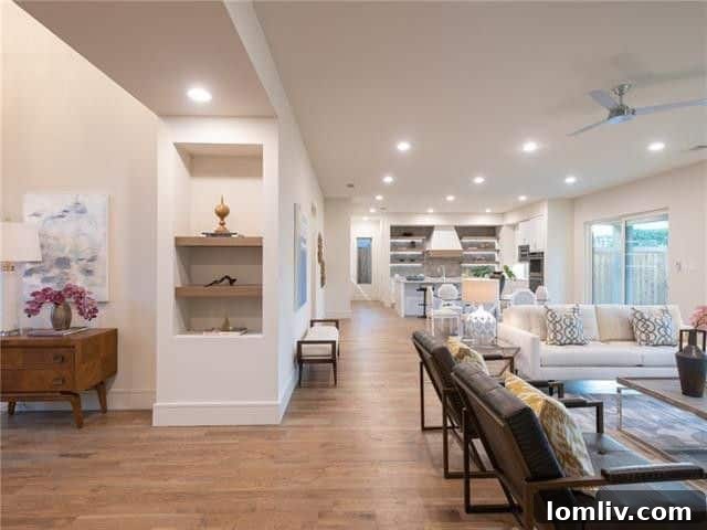 Spacious living area with modern fireplace and high ceilings