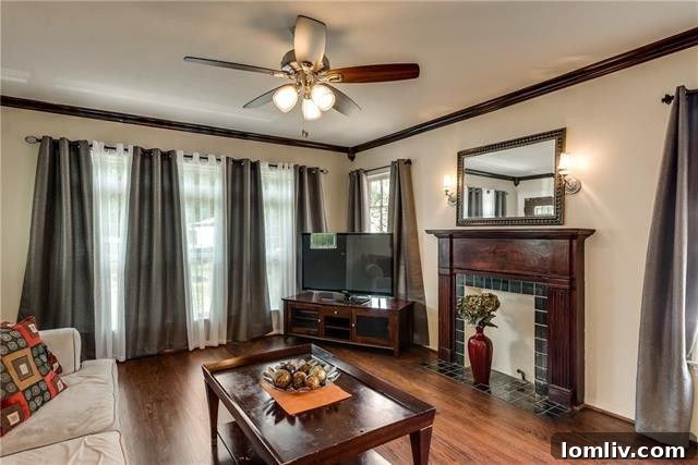Elegant dining area with sconce lighting and hardwood flooring