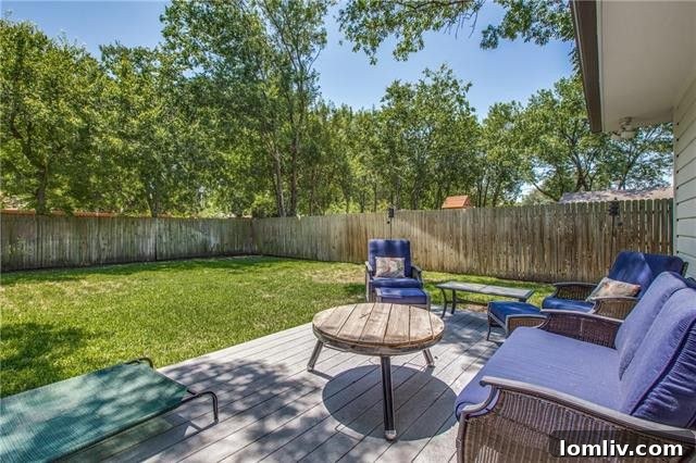 Another perspective of the large, shaded backyard