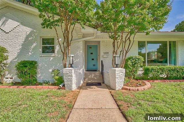 Charming white brick exterior of 1429 Foxgrove Circle Dallas
