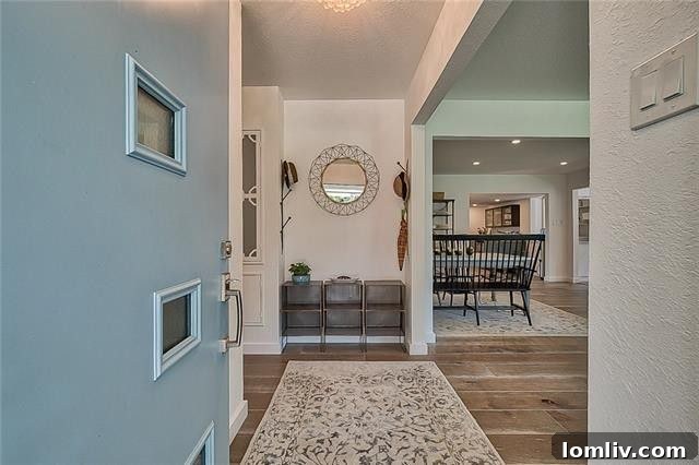 Bright and airy open concept living room with hardwood floors