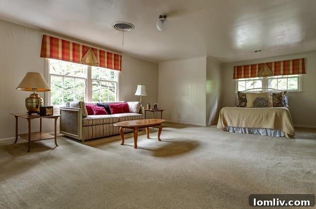 A comfortable bedroom on the lower level of 208 Rockwood Drive, offering privacy and serene views.
